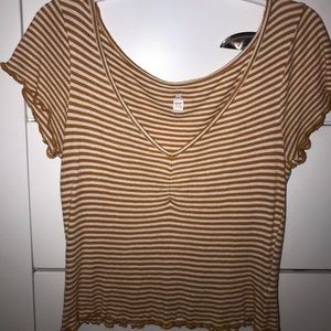 Orange and white striped crop top from Pacsun